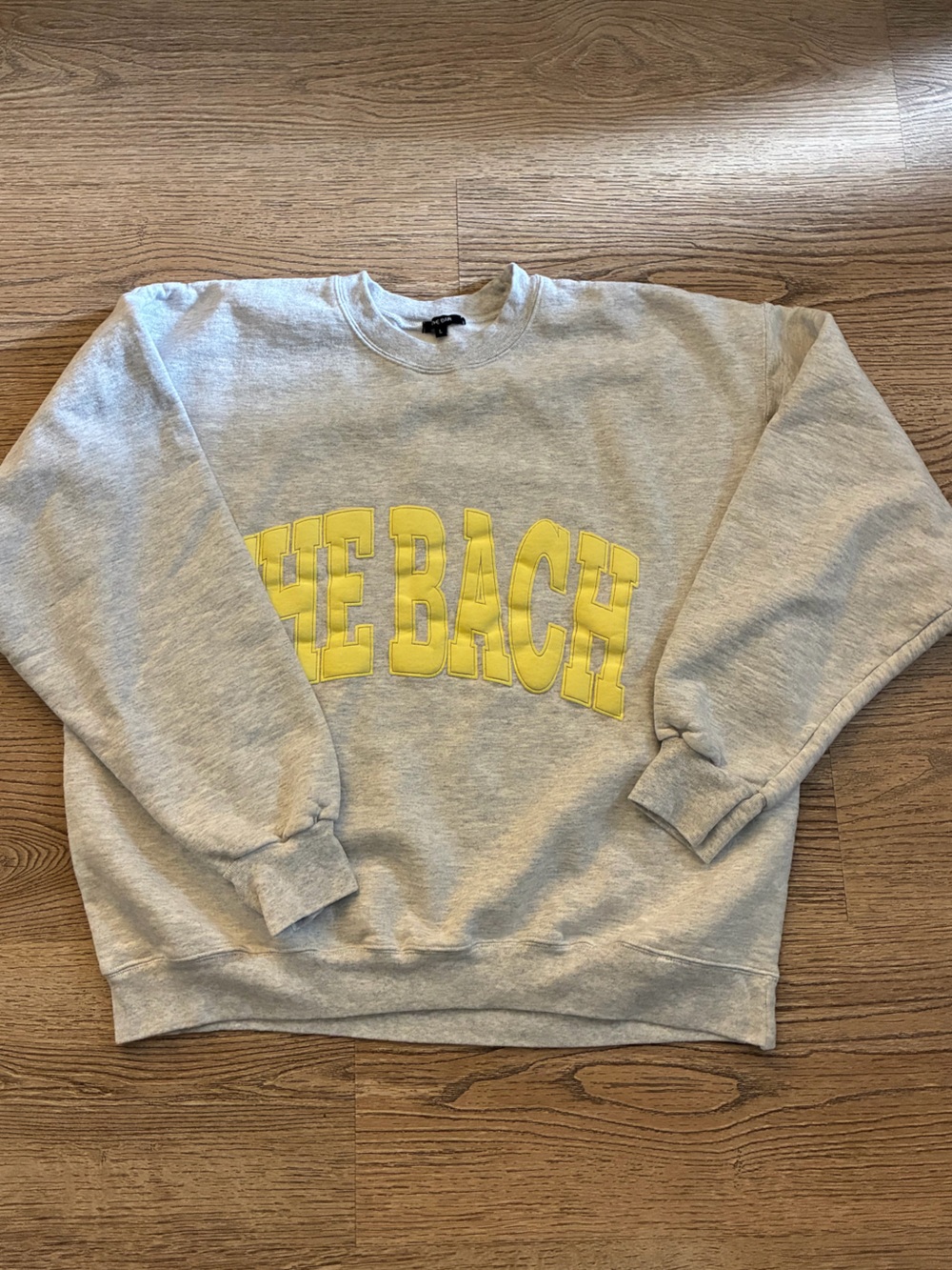 The Bar Light Gray Crewneck Sweatshirt with Yellow 'THE BEACH' Graphic